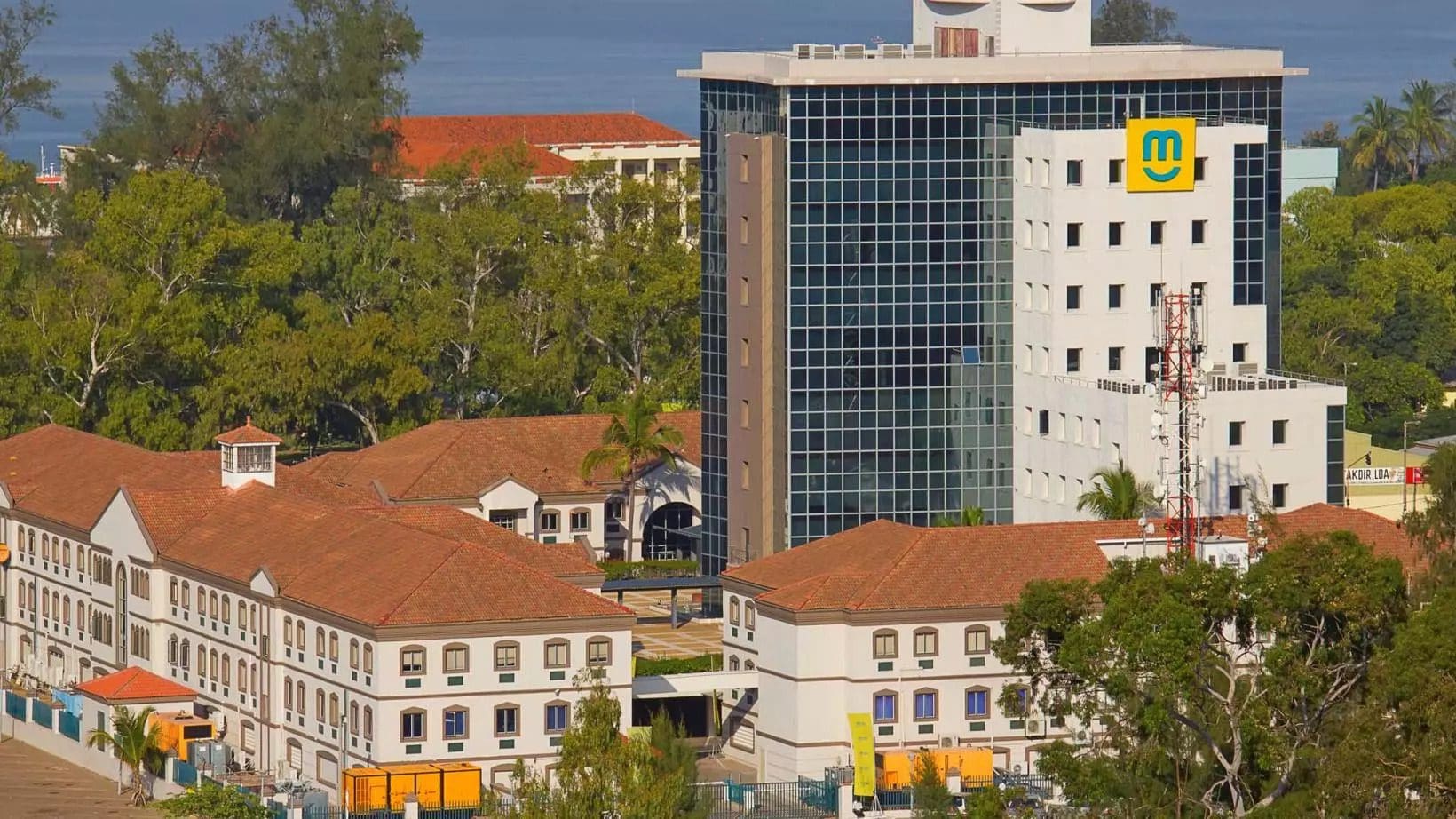 Modern and historical buildings side by side in an urban landscape.