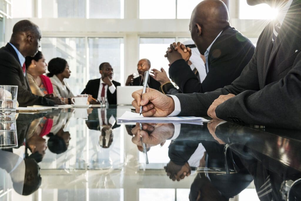 A group of people sitting around a table.