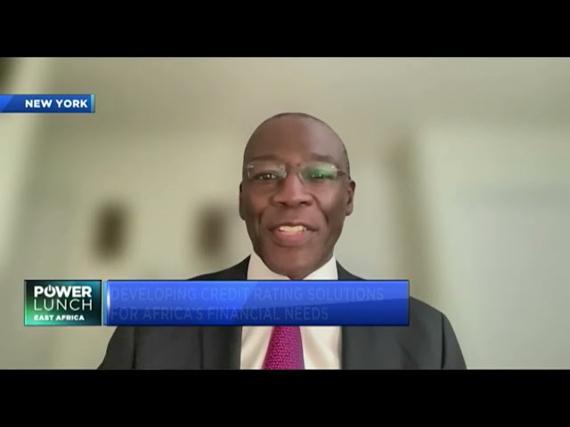 Man in suit speaking on camera.