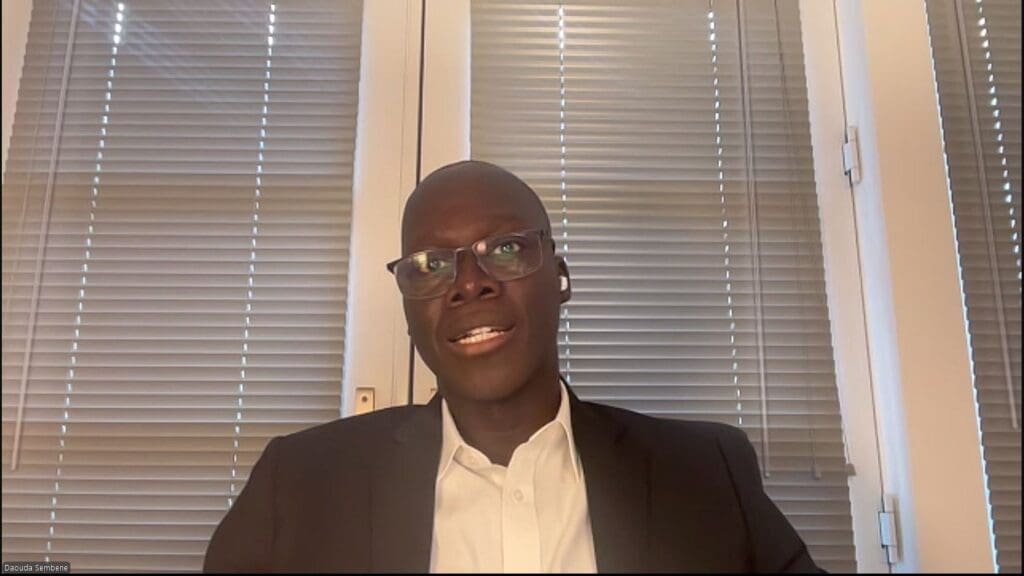 Man in suit and glasses, video call.