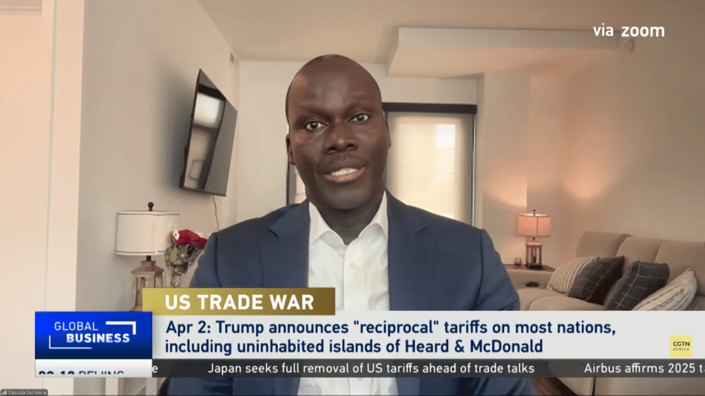 Man discussing US trade war on video call.