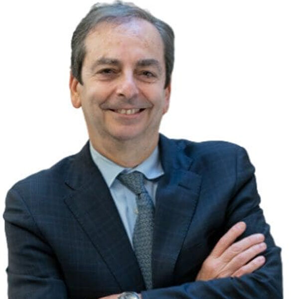 Man in a suit with arms crossed.
