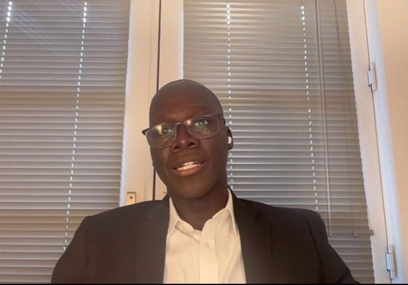 Man in suit and glasses, video call.