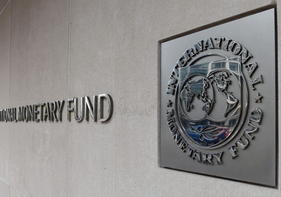 International Monetary Fund logo on wall.