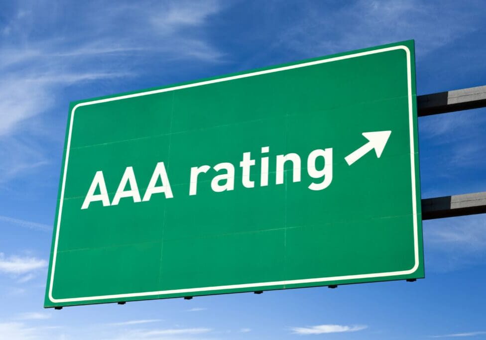 Green road sign with AAA rating arrow.