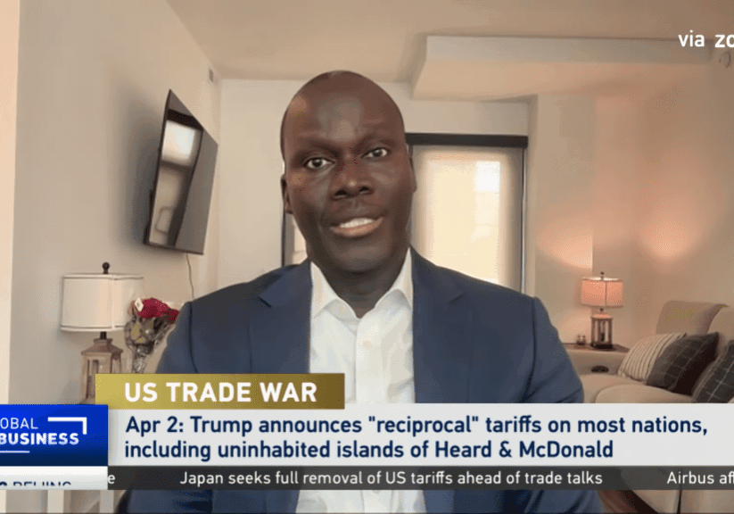 Man discussing US trade war on video call.
