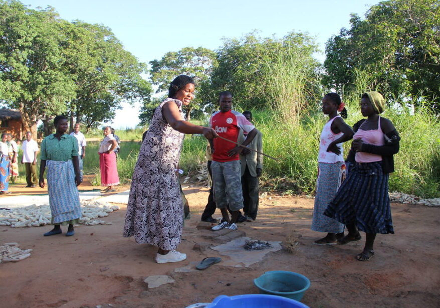 Women preparing cassava in rural Africa.
