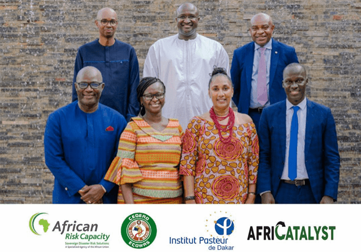 Group of professionals posing for a photo with organizational logos at the bottom.