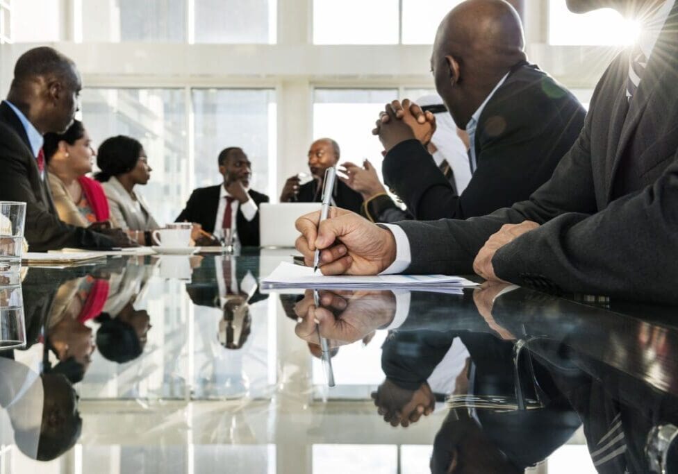 A group of people sitting around a table.