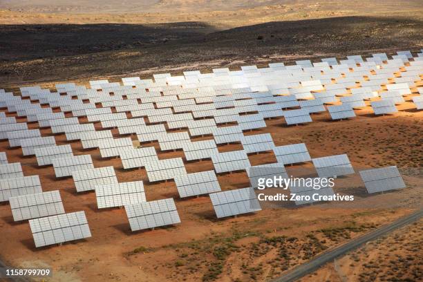 Solar panel array in a desert landscape.