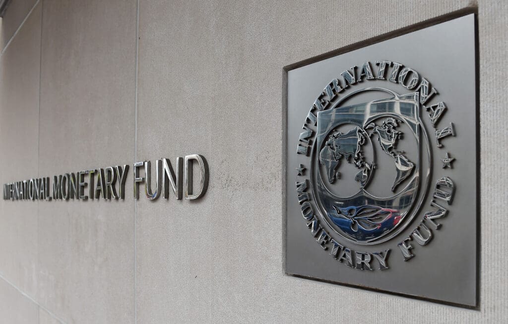 International Monetary Fund logo on wall.