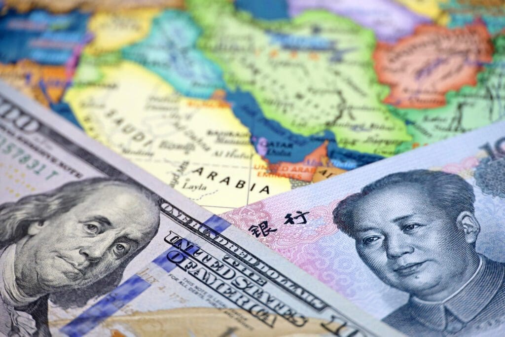 A close-up of various international currencies overlaying a map of the world, highlighting economic globalization.