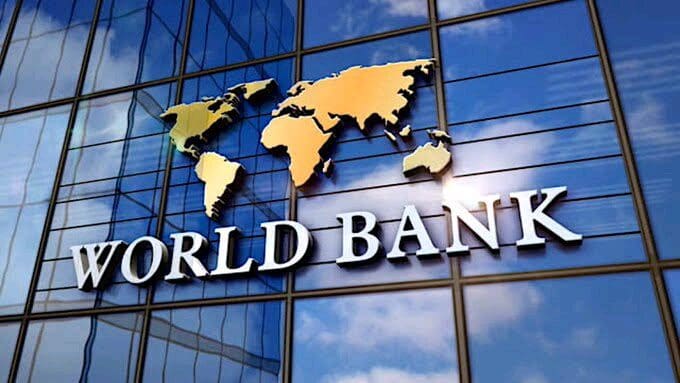 World bank logo with a map on the facade of a glass building.