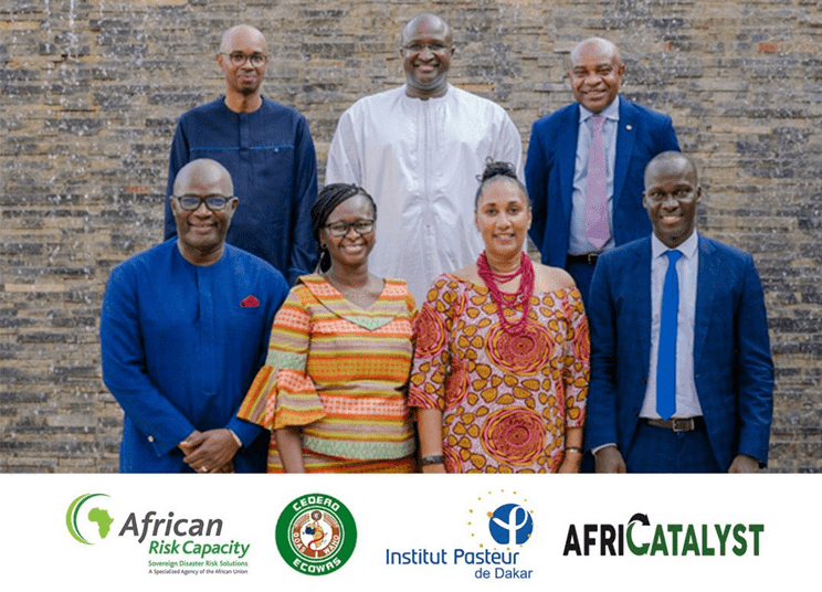 Group of professionals posing for a photo with organizational logos at the bottom.