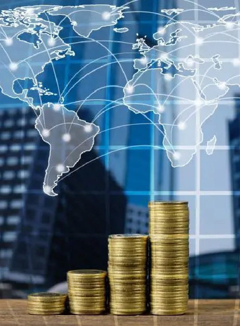 Stacks of coins in ascending order with a digital world map overlay and city skyline in the background, representing global financial growth or investment.