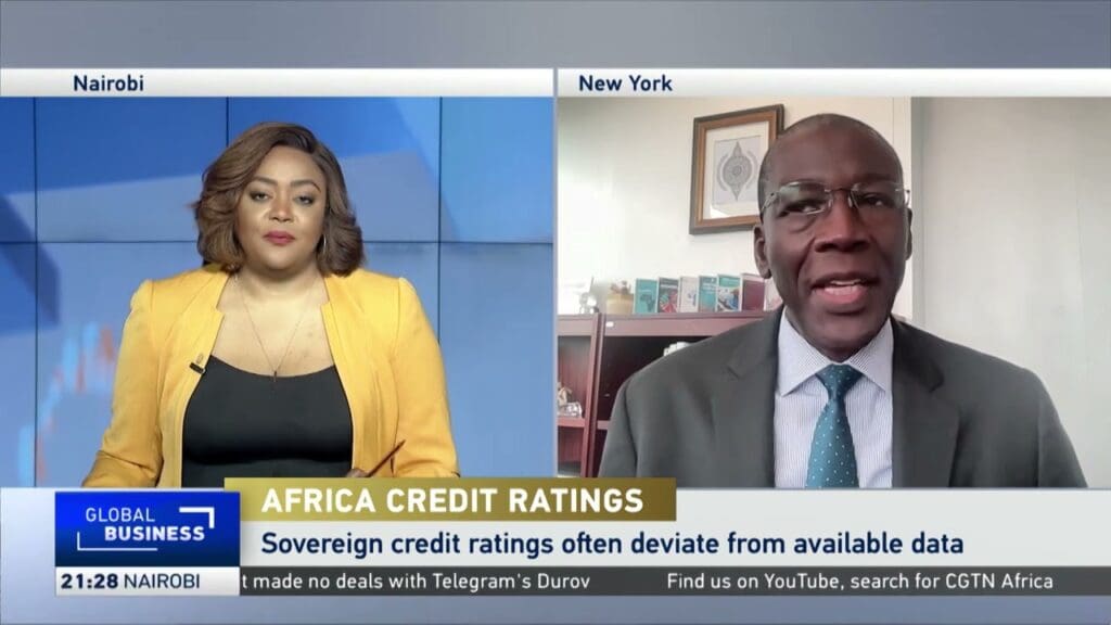 Two people discussing Africa credit ratings.