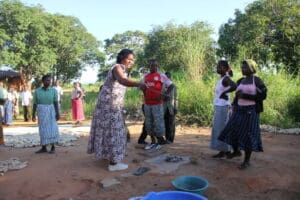 Women preparing cassava in rural Africa.
