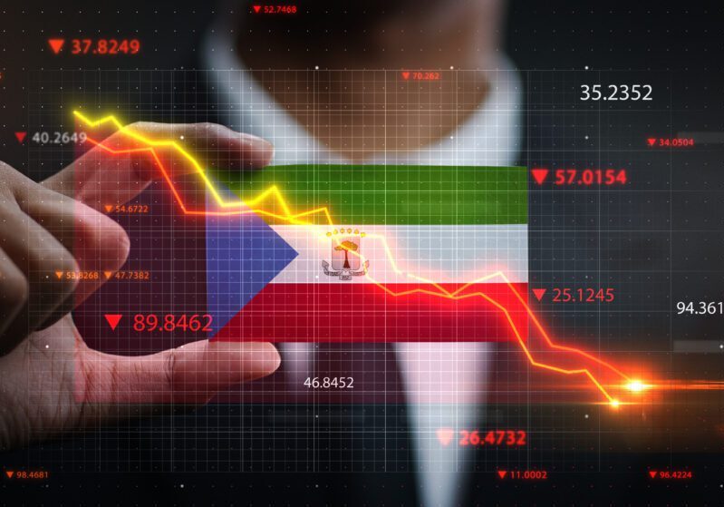 A person interacts with a holographic display of financial data, analyzing a downward trending stock market graph.