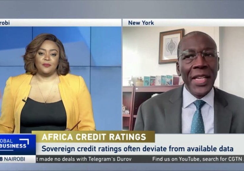 Two people discussing Africa credit ratings.