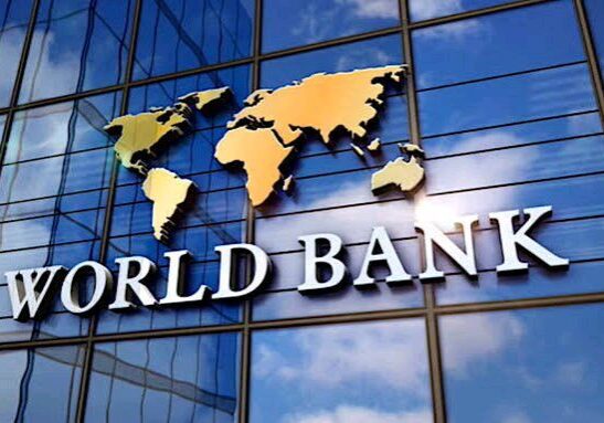 World bank logo with a map on the facade of a glass building.